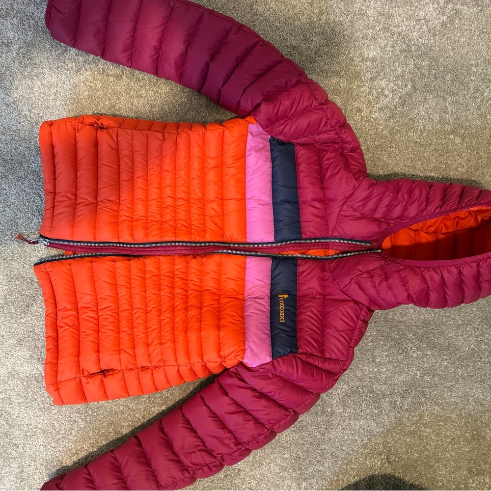 Cotopaxi Women's Puffer Jacket in Red, Orange, and Purple